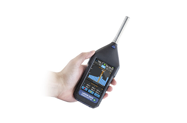 sound level meter in hand